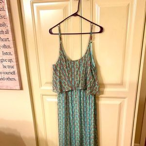 A beautiful blue green sundress with rust accents very silky material.